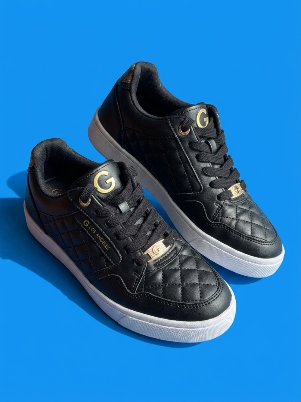 GBG Los Angeles Black Quilted Low-Top Sneakers with White Soles and Gold Accents